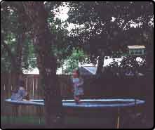 Girls at Dad's, on trampoline
